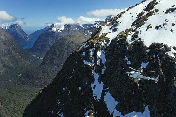 Helicopter approaches Milford Sound